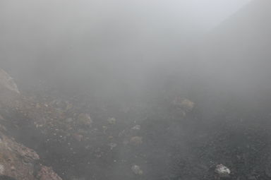 While not so visually stunning, this picture (barely) shows the several ton chunk of mountain that crumbled off while we were standing at the edge of the cone (it's the rock just right of the center, as well as some of the debris to the left).  Apparently our guide was serious when he kept saying, "muy peligroso."